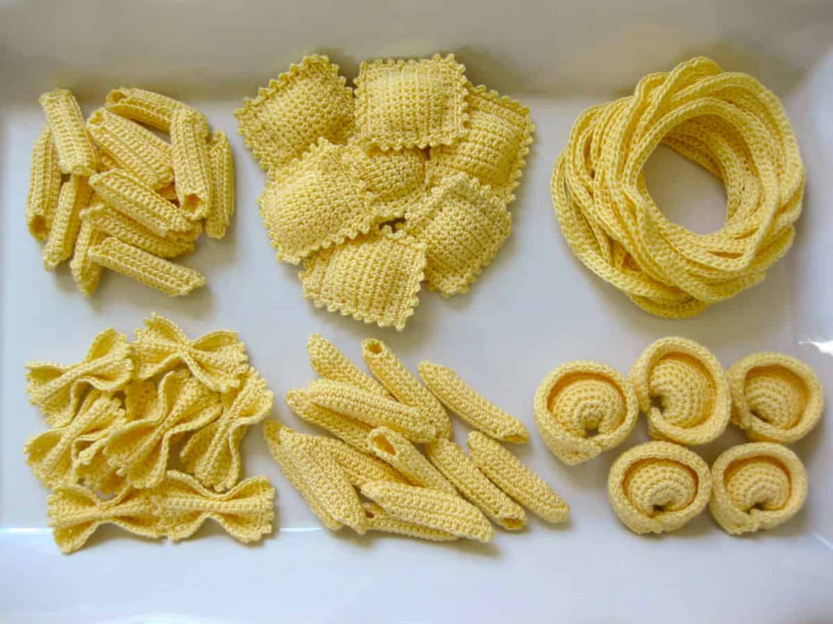 Compelling Resemblance of Crochet Piles of Yellow Pasta to Their Edible Counterparts